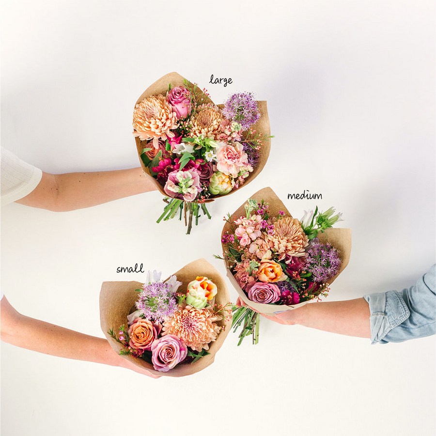 three flower bouquets wrapped in paper